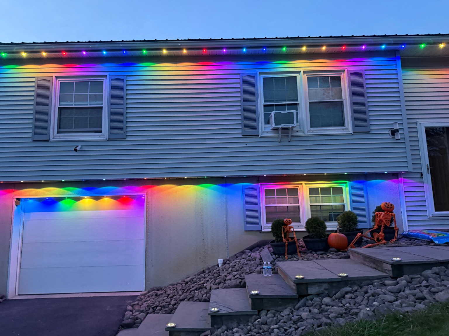 Susquehanna, Pennsylvania home with multicolor permanent lights along the upper roofline and garage facade